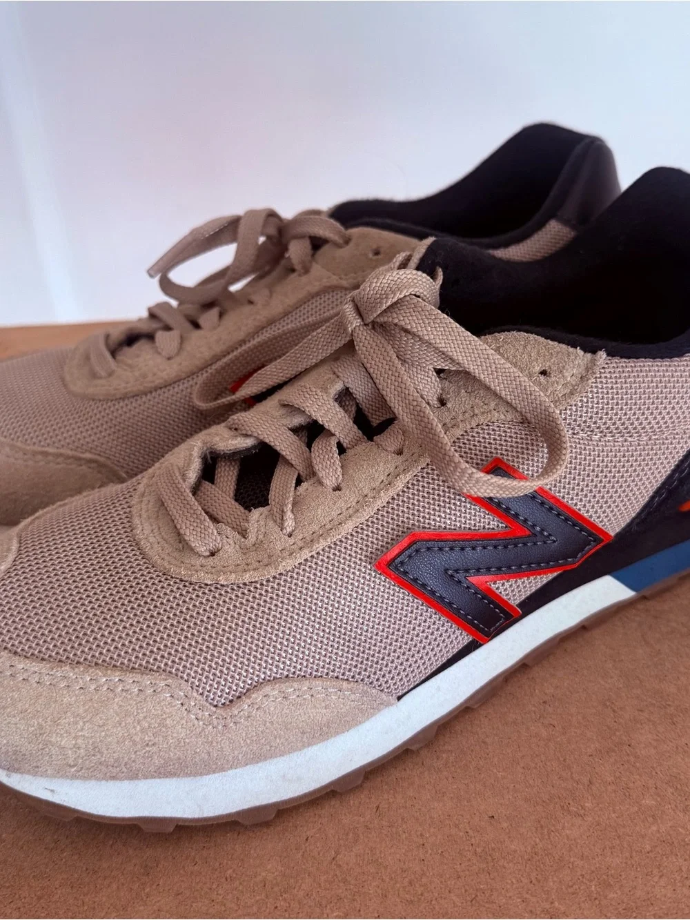 New Balance Men’s Beige and Black Athletic Sneakers with Red Accent
